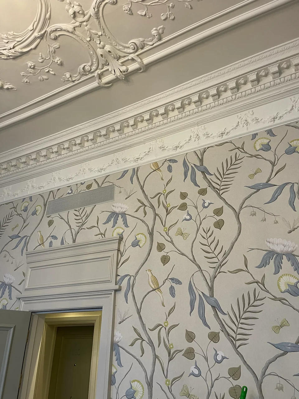 Botanical wallcovering meeting the detailed white cornice at Brown's Hotel, Mayfair.