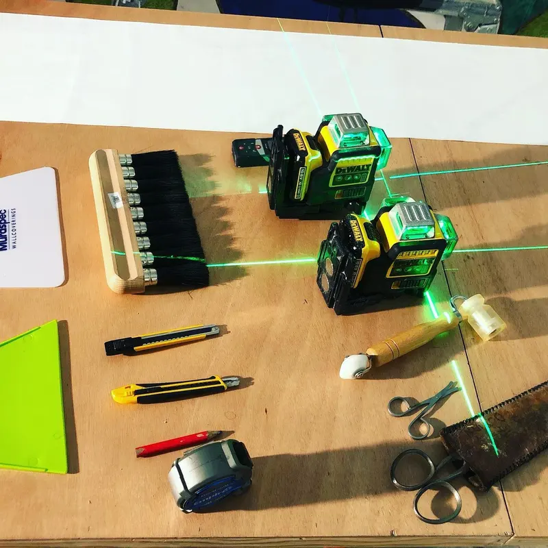 Laser levels, knives and tools laid out for the installation at Masterpiece London 2019.